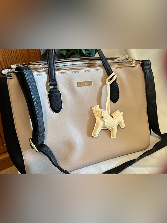 kate spade Handbags - Kate Spade Beige and Black Leather Shoulder Bag with Pegasus Charm